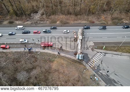 Aerial View Of Road Accident With Overturned Truck Blocking Traffic.
