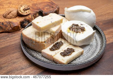 Italian Cheese Collection, Yellow Taleggio Cheese And Mozzarella With Black Truffles Mushrooms
