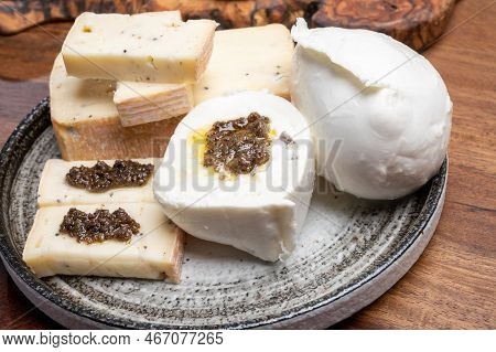 Italian Cheese Collection, Yellow Taleggio Cheese And Mozzarella With Black Truffles Mushrooms