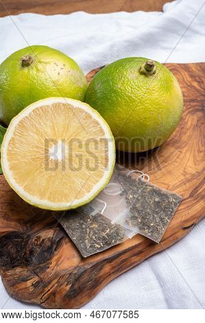 Fresh Ripe Bergamot Orange Fruits And Tea Bags, Fragrant Citrus Used In Earl Grey Tea, Medicine And