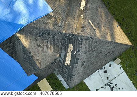 Hurricane Ian Damaged House Rooftop Covered With Protective Plastic Tarp Against Rain Water Leaking 