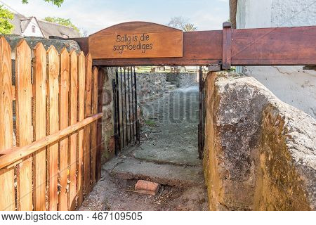 Elim, South Africa - Sep 21, 2022: Exit Below The Water Furrow, Feeding The Water Wheel At The Mill 