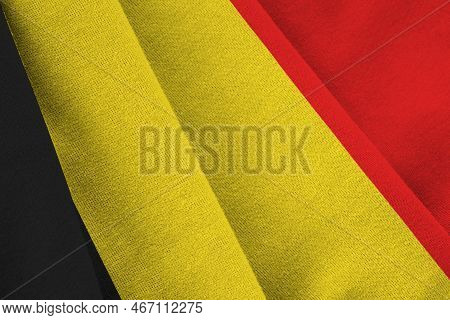 Belgium Flag With Big Folds Waving Close Up Under The Studio Light Indoors. The Official Symbols And