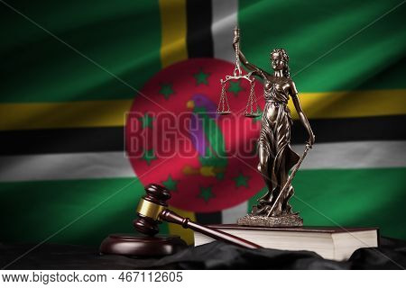 Dominica Flag With Statue Of Lady Justice, Constitution And Judge Hammer On Black Drapery. Concept O