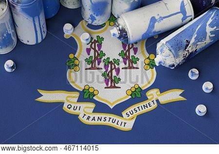 Connecticut Us State Flag And Few Used Aerosol Spray Cans For Graffiti Painting. Street Art Culture 