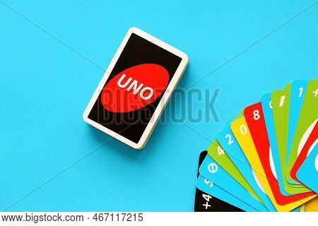 Ternopil, Ukraine - May 15, 2022: Many Colorful Uno Game Cards On Blue Background Close Up. Uno Is A