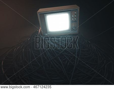 An Illuminated Vintage 80's Television Perched On A Jumbled Pile Of Black Cables On A Dark Omnious B