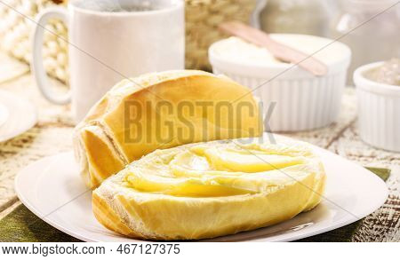 Slice Of Salt Bread Cut With Butter, Called French Bread In Brazil, Brazilian Tradition