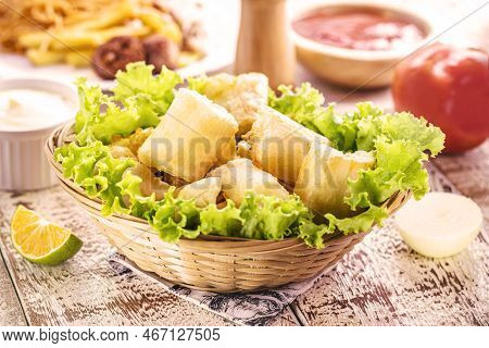 Fried Cassava With Vegetables And Sauces, A Typical Brazilian Snack Served In Restaurants And Bars, 