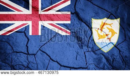 Flag Of Anguilla. Anguilla Symbol. Flag On The Background Of Dry Cracked Earth. Anguillan Flag With 