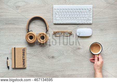 Unretired Concept Image For Great Unretirement Trend. Flat Lay With Modern Office Supplies - Noteboo