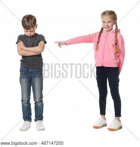Girl Laughing And Pointing At Upset Boy On White Background. Children's Bullying