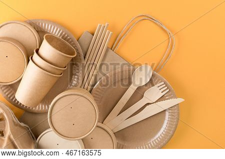 Paper Utensils Bundle, Food Packaging Articles Over Orange Background. Street Food Paper Packaging, 