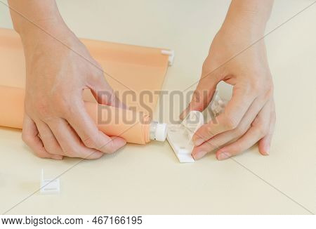 Assembly Of Roller Blinds. Women's Hands Are Assembling Roller Blinds