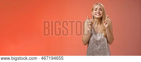 Nervous Hopeful Blond Young Woman In Silver Trendy Dress Close Eyes Grimacing Eager Wish Come True C