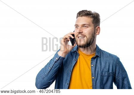 Young Smilin Caucasian Male In Casual Outfit Chatting On Smartphone, Isolated On White Background