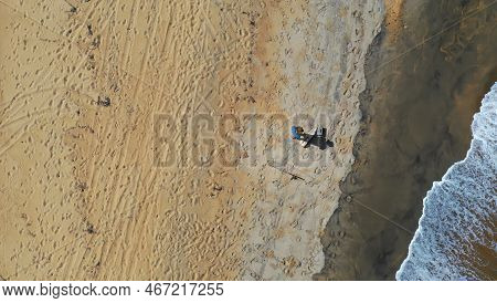 Aerial View Of A Man On The Beach Getting Ready To Go Fishing In North Queensland Australia