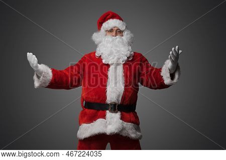Hospitable Santa Claus With Glasses Looking At Camera