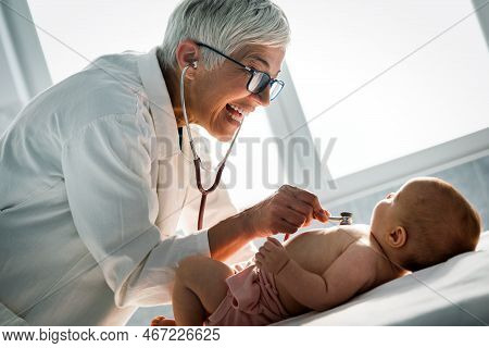 Pediatric Doctor Exams Little Baby. Health Care, Medical Examination, People Concept