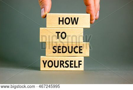 How To Seduce Yourself Symbol. Concept Word How To Seduce Yourself On Wooden Blocks. Businessman Han