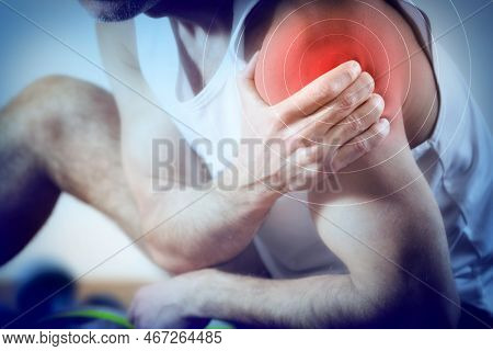 Detail Of A Representation Of Pain In The Shoulder With Red Color On A Bluish Image. Front View.