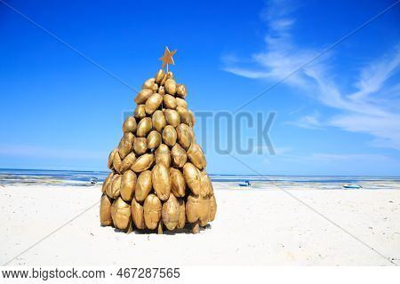 A Golden Christmas Tree Made Of Coconuts On The White Beaches Of Zanzibar
