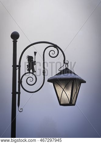 A Backlit Street Lamp In A Winter Alpine Landscape