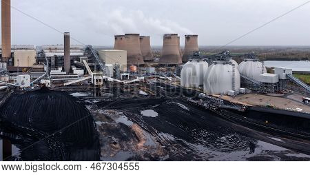 Aerial Panorama View Of A Large Coal Fired Power Plant With Stocks Of Coal Ready To Burn During The 