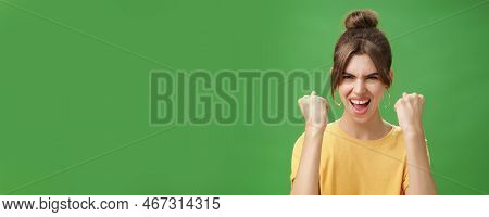 Woman With Spirit Of Winner Raising Clenched Fists Smiling Excited And Supportive Cheering Being Rea