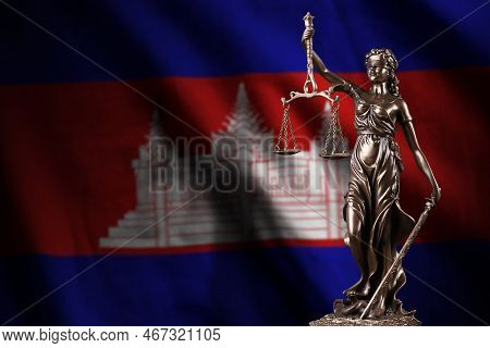 Cambodia Flag With Statue Of Lady Justice And Judicial Scales In Dark Room. Concept Of Judgement And