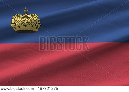 Liechtenstein Flag With Big Folds Waving Close Up Under The Studio Light Indoors. The Official Symbo