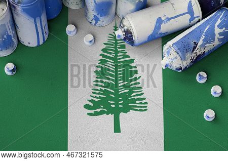 Norfolk Island Flag And Few Used Aerosol Spray Cans For Graffiti Painting. Street Art Culture Concep