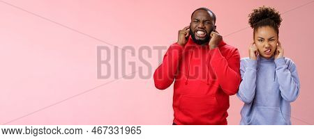 Irritated Annoyed Couple African American Siglings Man Woman Cringing Discomfort Close Ears Plug Fin