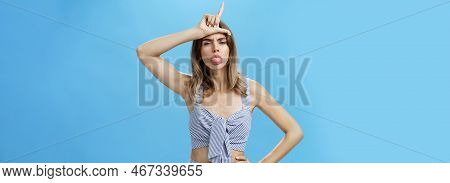 Waist-up Shot Of Stylish Self-assured Woman With Tattoo Feeling Like Winner Mocking Over Losers Stic
