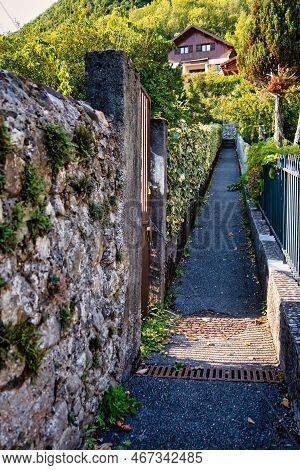 Menthon Saint Bernard, France - September 10 2020 : A Small Alley Way On A Slope In The Mountains Wi