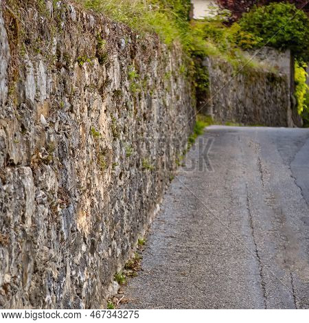 Menthon Saint Bernard, France - September 10 2020 : The Historic Stone Protection Wall Of A Castle O
