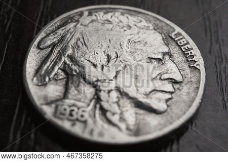 Us Nickel Lies On A Dark Table Surface. Coin 5 Five Cents Close Up. Indian Head Nickel. News About U