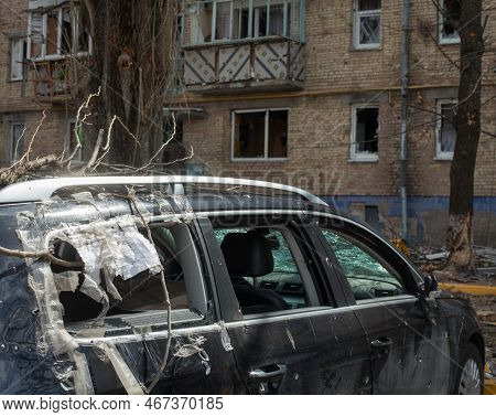 Irpin, Kyiv Region, Ukraine -  April 12, 2022: Russian Invasion Of Ukraine. Car Damaged By Russian S