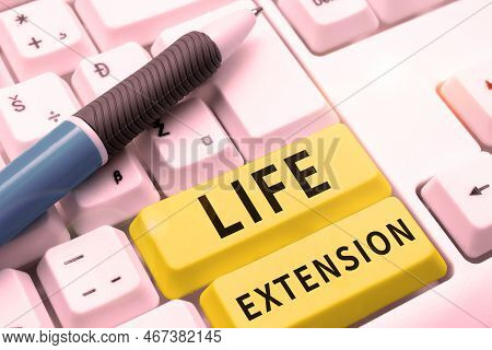 Hand Writing Sign Life Extension. Concept Meaning Able To Continue Working For Longer Than Others Of