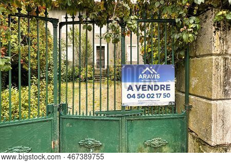 Thones, France - October 04 2021 : A French For Sale Sign Is Posted On The Green Entrance Gate Of An