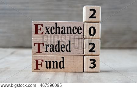 Exchance Traded Fund 2023 - Words On Wooden Blocks On Gray Background. Business Concept