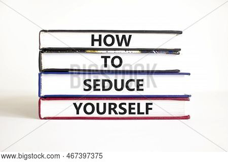 How To Seduce Yourself Symbol. Concept Word How To Seduce Yourself On Books. Beautiful White Table W