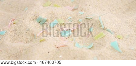 Conceptual Composition Of Microplastics And Coastal Sand. The Impact Of Microplastic On Nature. The