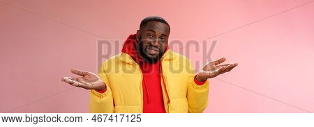 Close-up Clueless Unaware Handsome Stylish African-american Bearded Man In Yellow Jacket Shrugging H