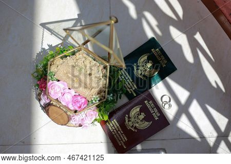 Glass ring box with Marriage Book, a legal declaration book for marriages in Indonesia