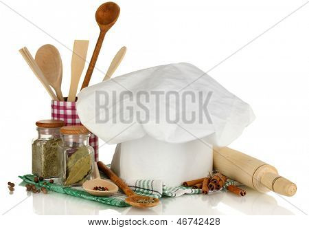 Kochmütze mit Löffel und Federballschläger, isolated on white