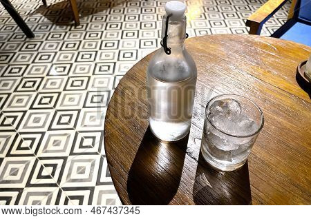 Refreshing Cold Vodka In The Bottle With Ice Rocks In The Glass Served In The Pub Good Liquor In Hap