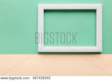 White Frame On A Green Background, Top View. Minimalism. Business Plan, Planning For The Month. Plac