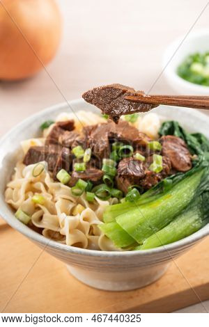 Beef Noodle Soup. Taiwanese Famous Food In A Bowl On Wooden Table.