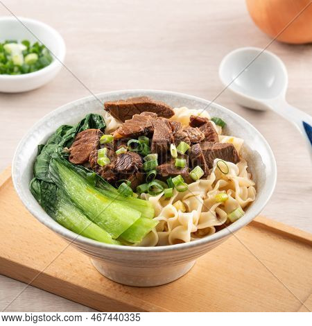 Beef Noodle Soup. Taiwanese Famous Food In A Bowl On Wooden Table.